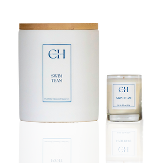 Candle with wooden lid and 'CH Swim Team' label on a white background